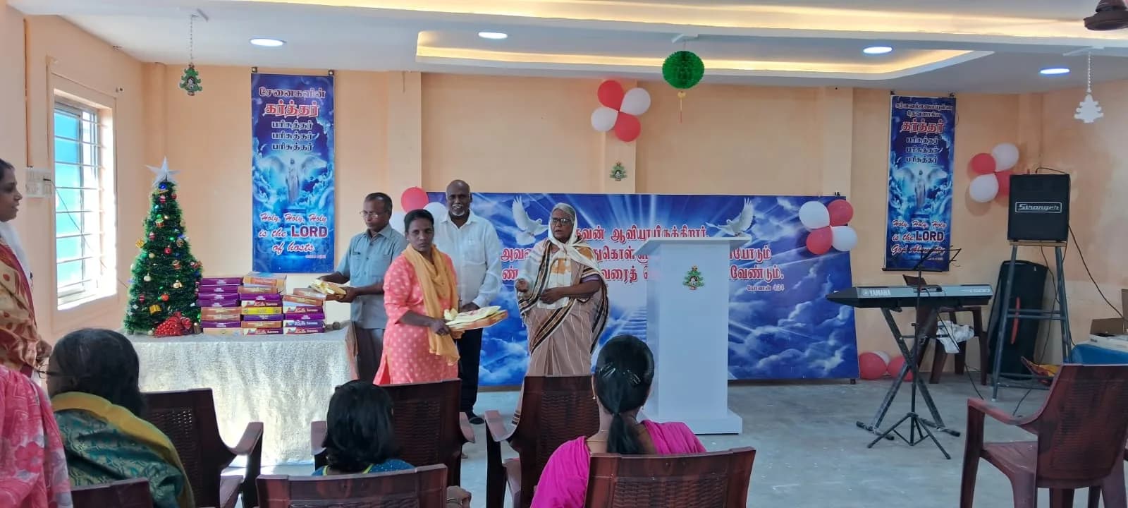 An adult participant receiving practical support at a community event in Puducherry